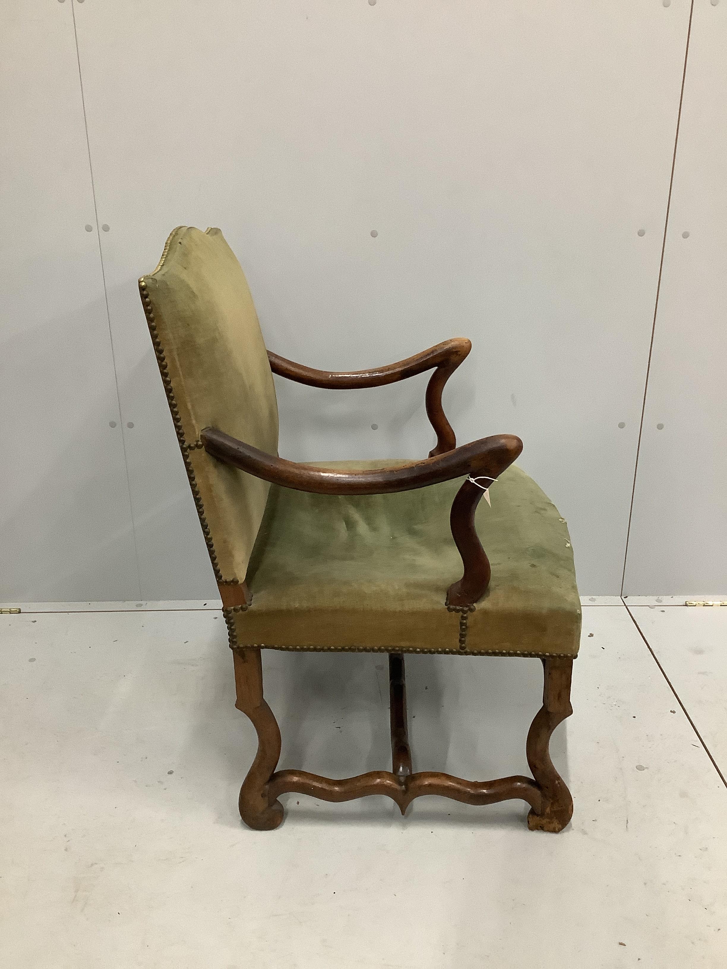 An 18th century French walnut elbow chair, width 63cm, depth 57cm, height 95cm